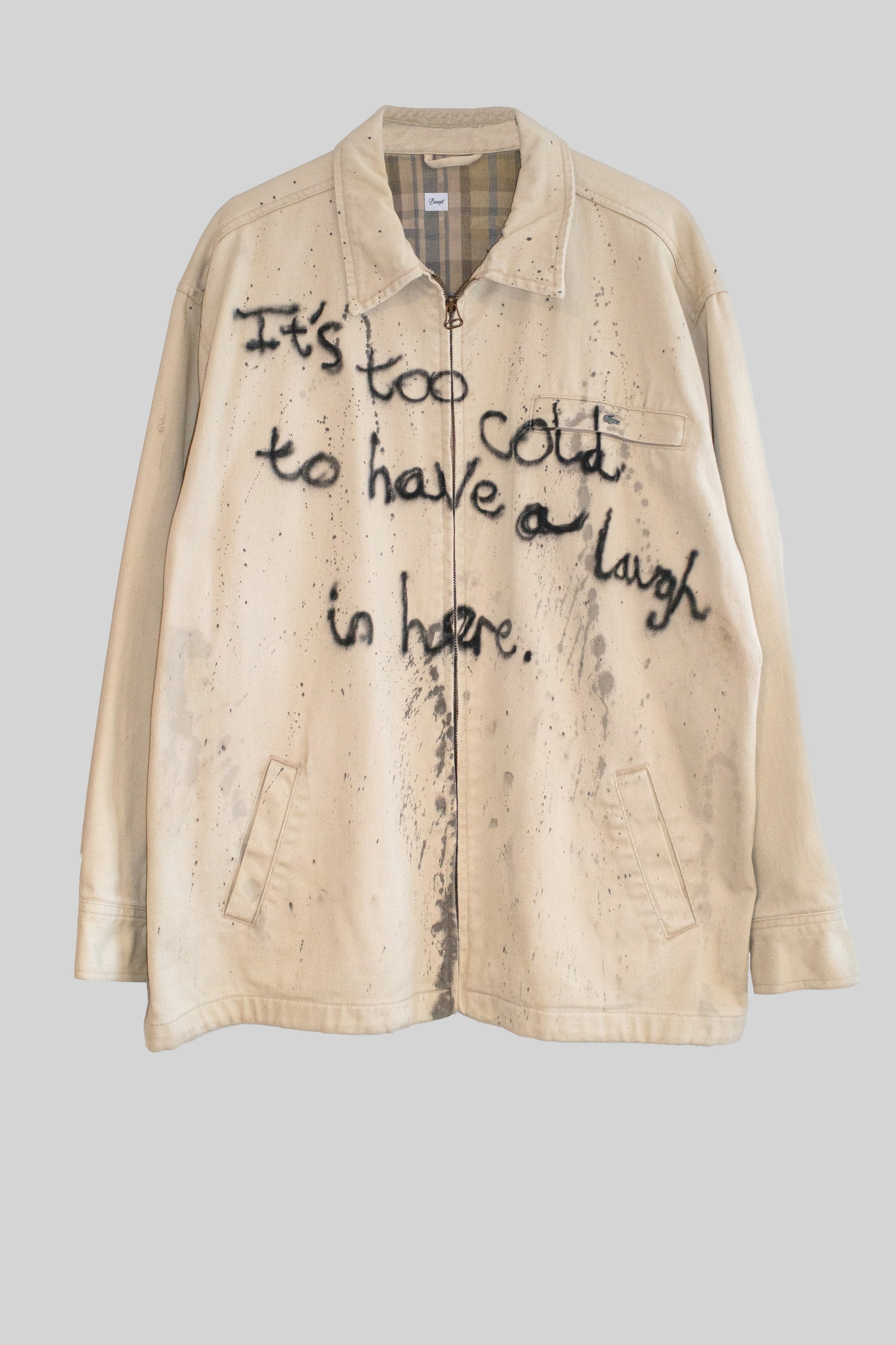 Beige jacket with text on a gray background