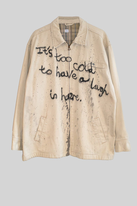 Beige jacket with text on a gray background