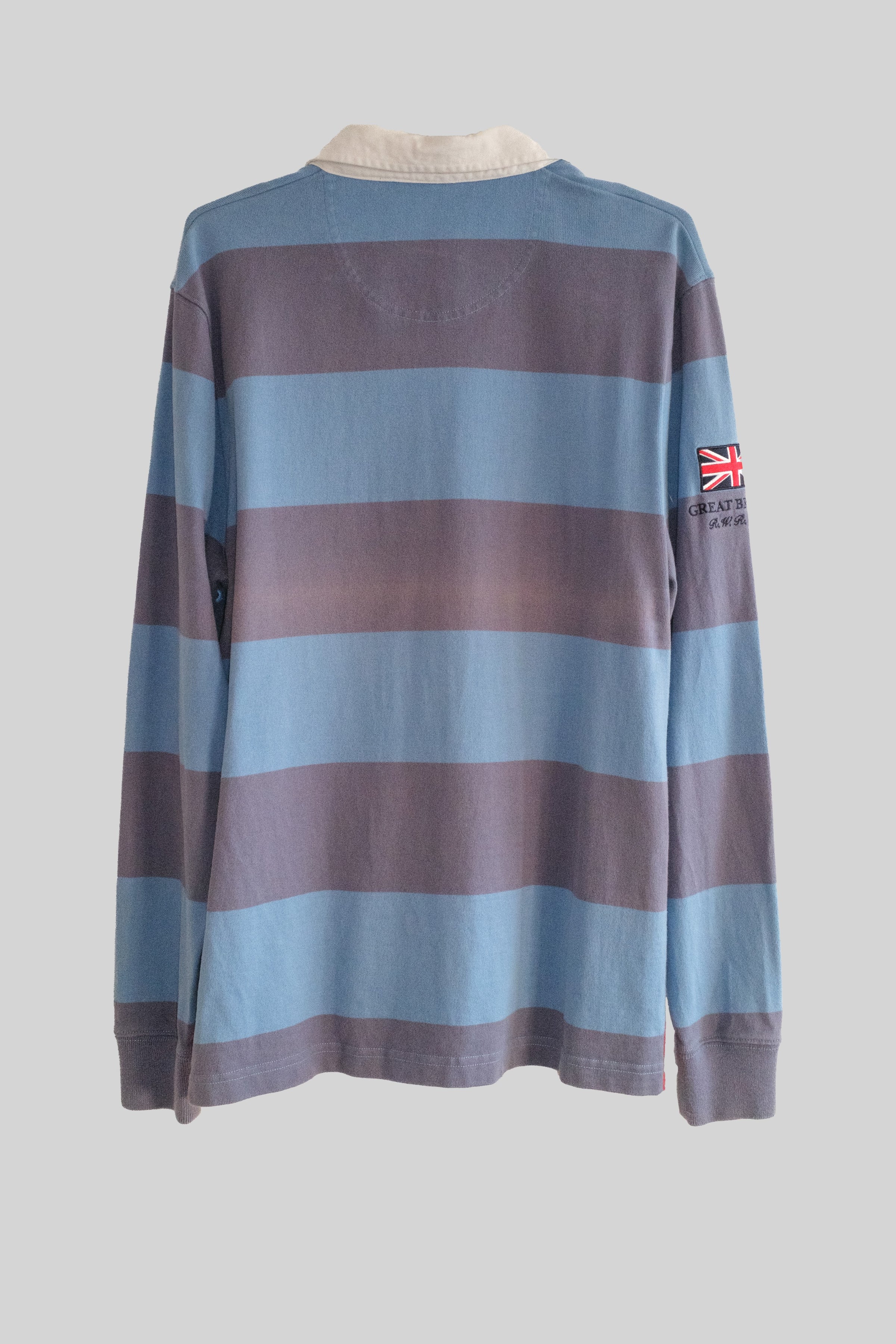 Striped long-sleeve shirt with a Union Jack flag patch on a light gray background