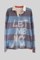 Striped long-sleeve shirt with 'LET ME MC' text on a gray background