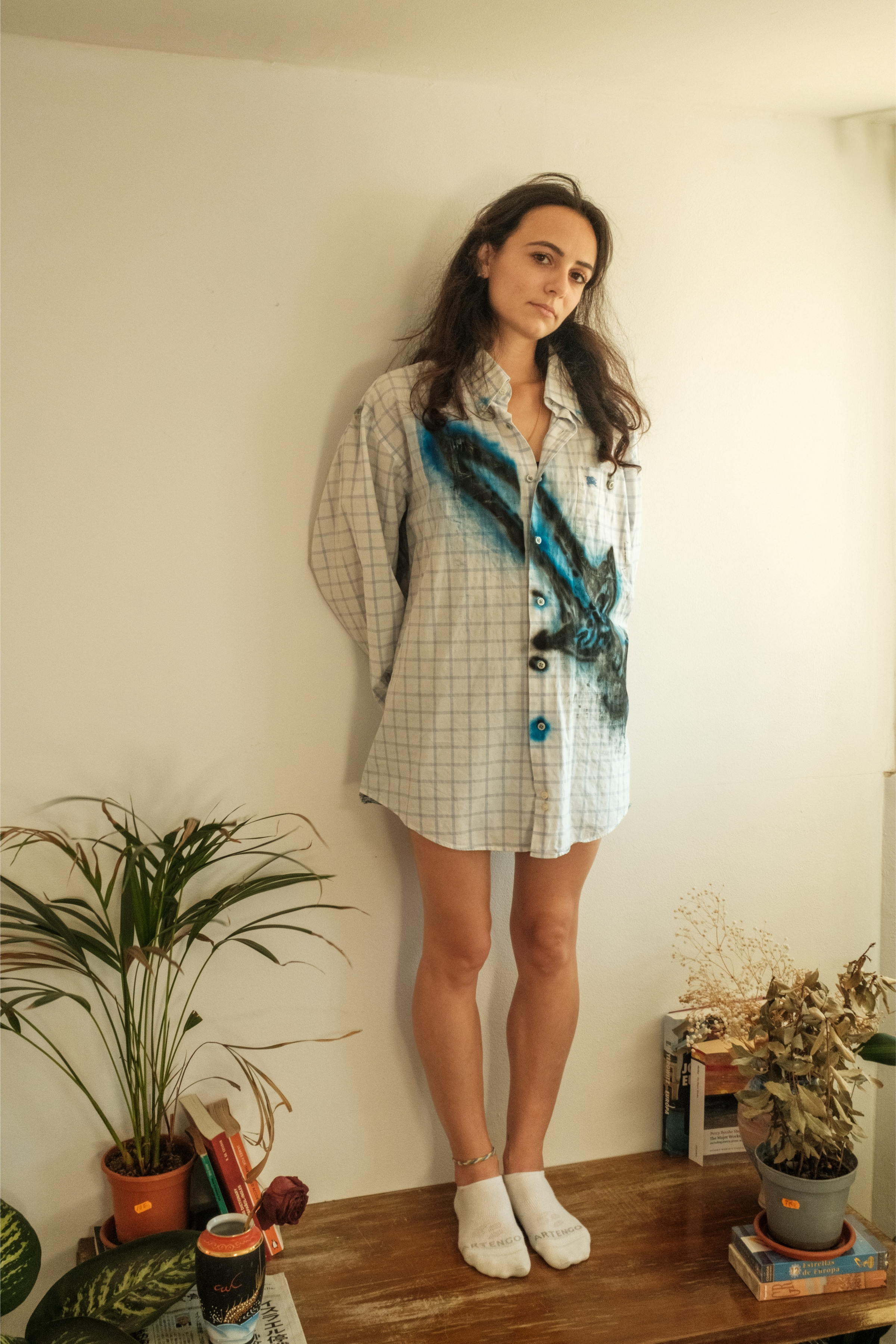 Oversized check shirt with bold blue spray detail, styled casually, Bewept Bag of Man.