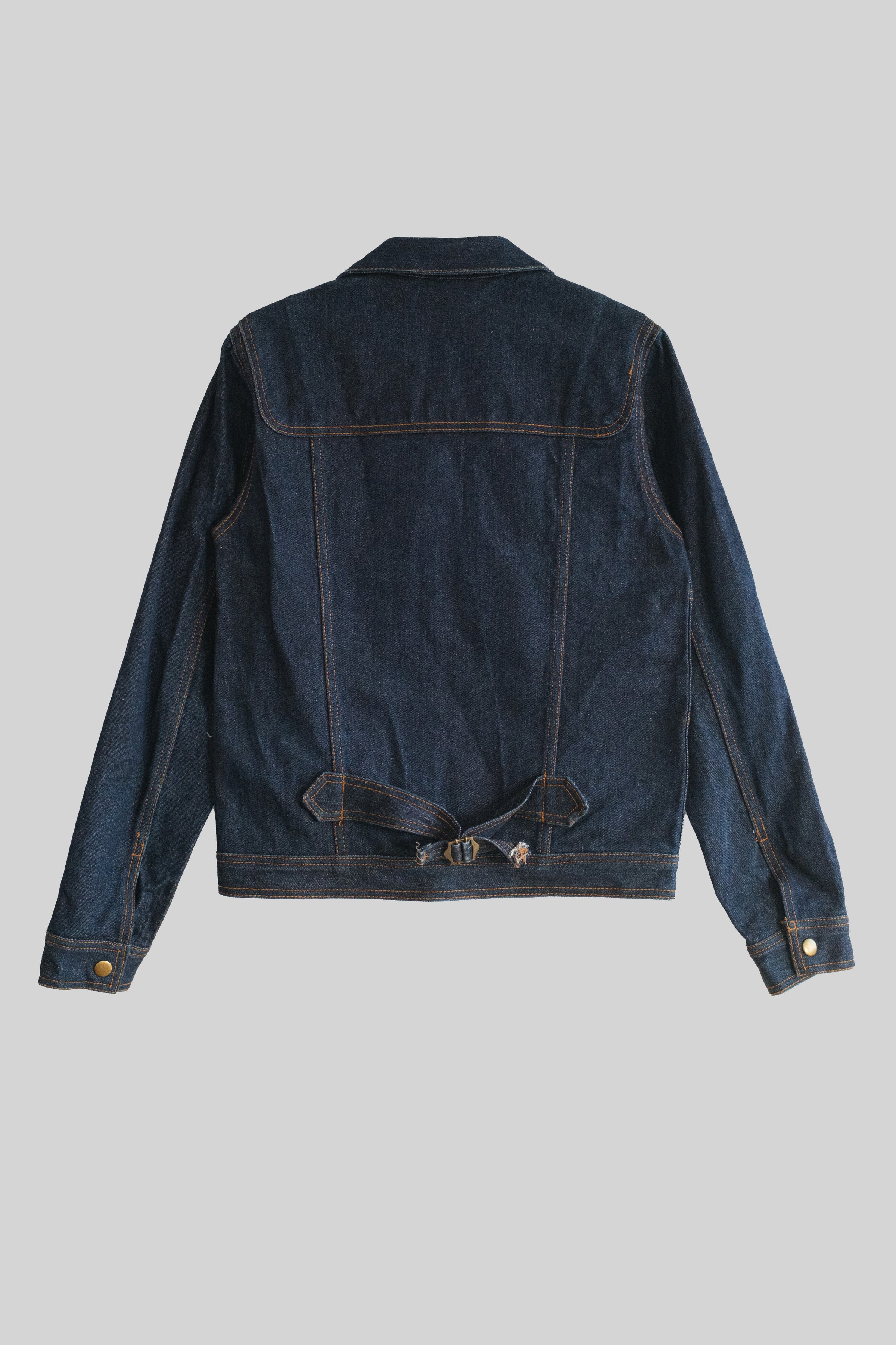 Blue denim jacket on a gray background